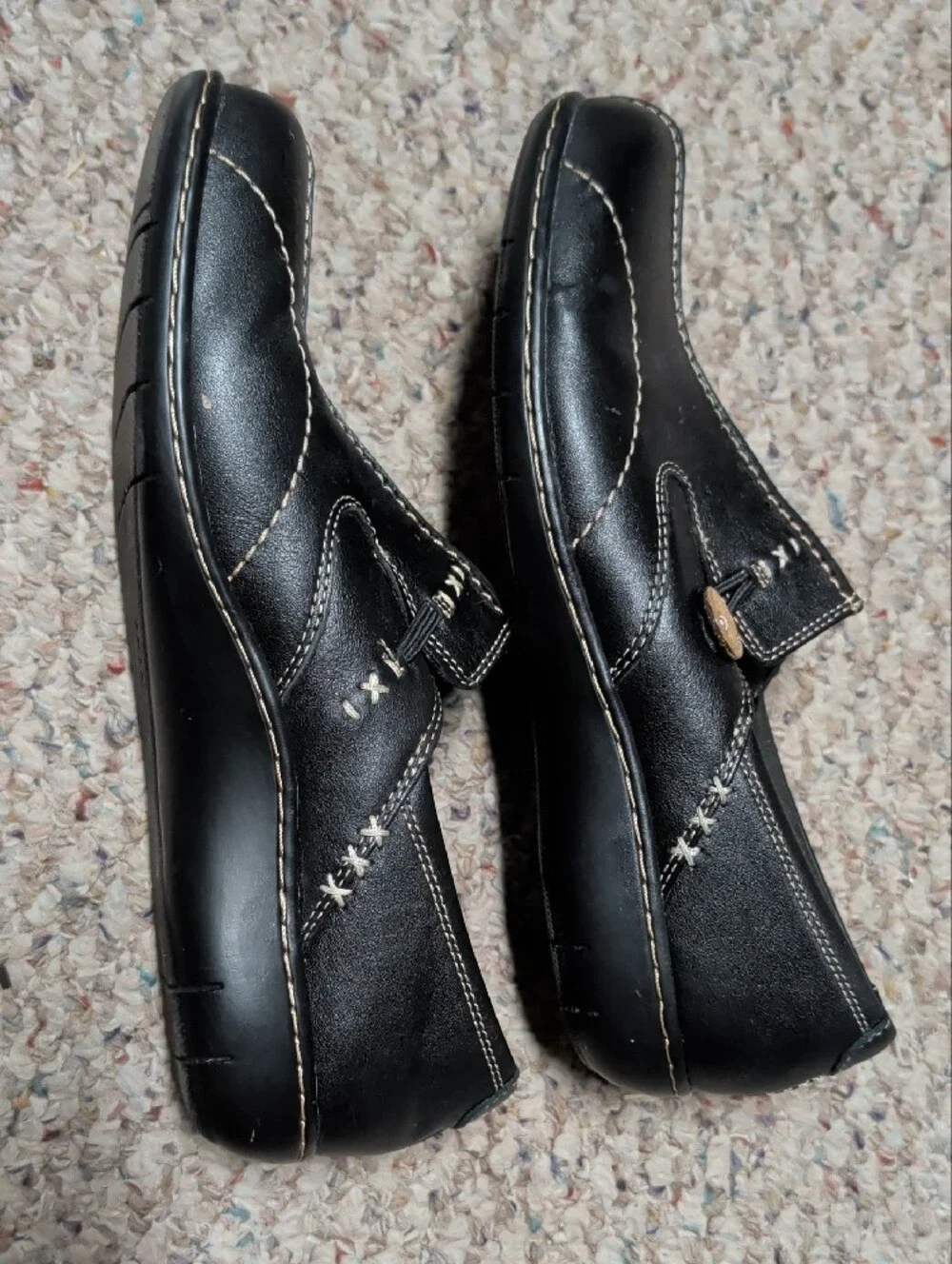 Clarks Black Leather Slip-On Loafers with Contrast Stitching and Button Accent